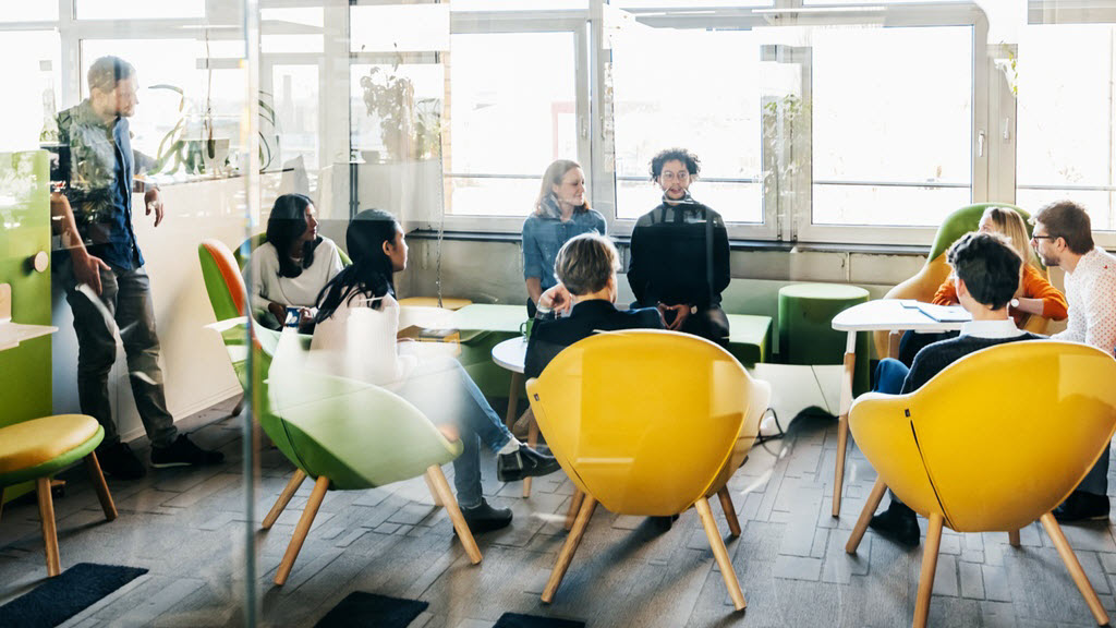 picture of people sitting around a meeting room